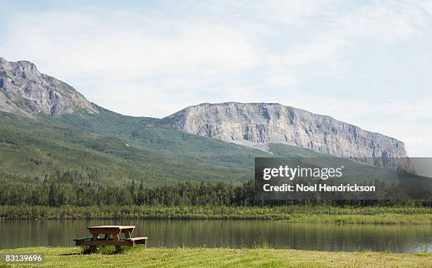 picnic table near remote river shore - northwest territories stock pictures, royalty-free photos & images