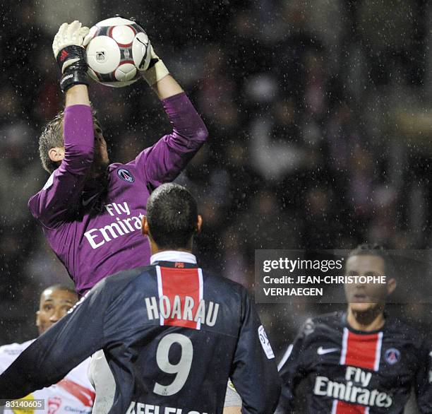 Paris' goalkeeper Mickaël Landreau catches the ball as forward Guillaume Hoarau looks on, during their French L1 football match at Marcel Picot...
