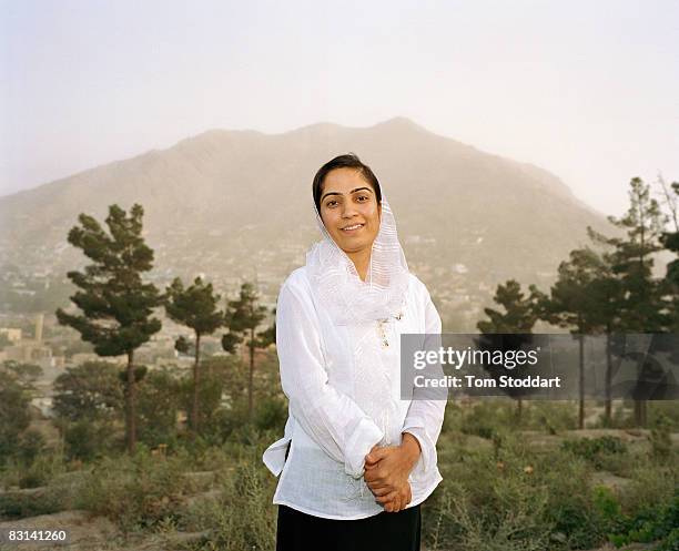 Afghani Member of Parliament Malalai Joya enjoys a rare period of peace in a park overlooking Kabul. The fiery young human rights activist fears she...