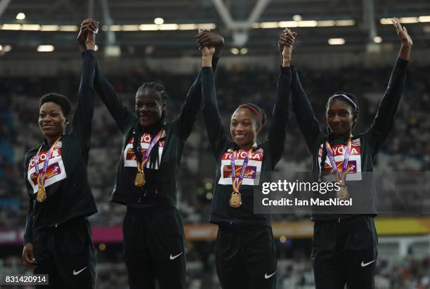 Phyllis Frances, Shakima Wimbley, Allyson Felix and Quanera Hayes pose with their gold medals from the Women's 4x400m Relay final during day ten of...