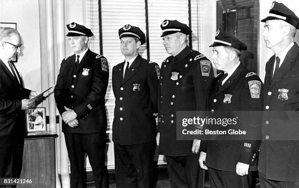 Boston Police Commissioner Edmund McNamara, far left, stands with new Deputy Superintendents of the Boston Police Department on Apr. 15, 1969. From...