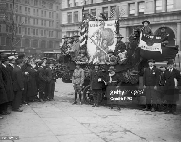 Members of the Boy Scouts of America promoting the sale of Liberty Bonds in aid of the Allied war effort, New York, circa 1918.