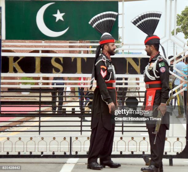 Pakistan Jawans stand guard during a ceremony to celebrate Pakistanis Independence Day at the India-Pakistan Wagah Border post on August 14, 2017...