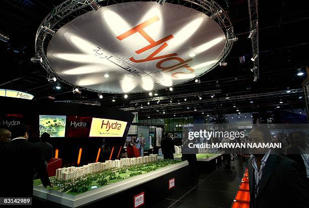 Visitors pass by HYDRA properties stand on the opening day of the Cityscape 2008 international real estate exhibition in Dubai on October 6, 2008. A...