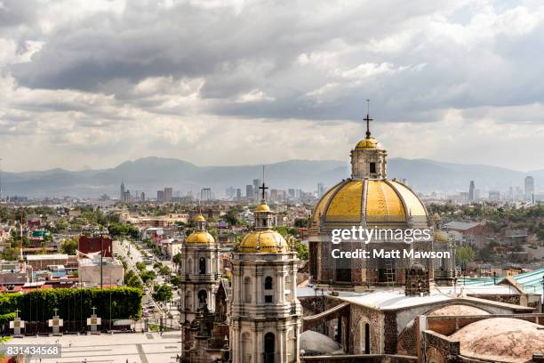 guadalupe basilica church and mexico city skyline - ciudad de méxico fotografías e imágenes de stock