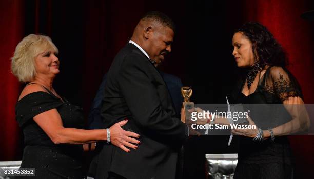 Leon Spinks is greeted by Rasheda Ali as Spinks is inducted into the Nevada Boxing Hall of Fame at the fifth annual induction gala at Caesars Palace...