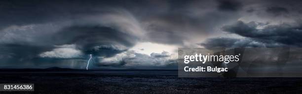 thunderstorm in a large desert (day) - meteorology stock pictures, royalty-free photos & images