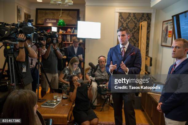 White nationalist Richard Spencer and Nathan Damigo of Identity Evropa speak to select media in a building serving as office space on August 14, 2017...
