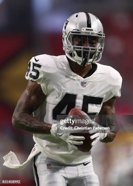 Running back George Atkinson of the Oakland Raiders warms up before the NFL game against the Arizona Cardinals at the University of Phoenix Stadium...