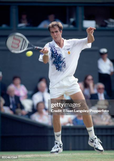 Todd Martin of the USA in action during a men's singles match at the Wimbledon Lawn Tennis Championships in London, circa July 1994. Martin was...