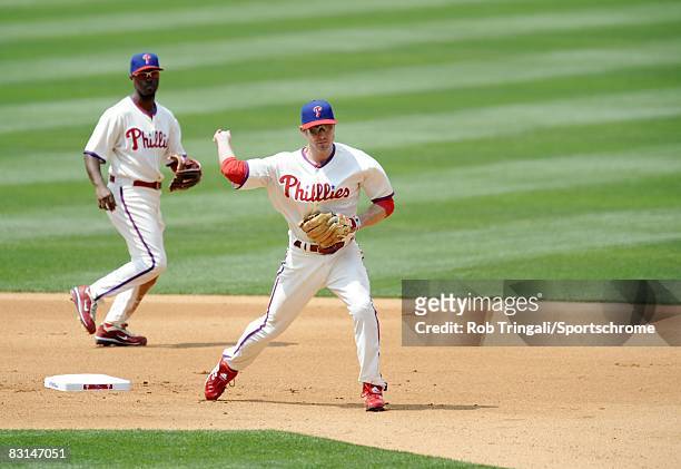 Chase Utley of the Philadelphia Phillies throws to first base against the Los Angeles Angels of Anaheim at Citizens Bank Park on June 22, 2008 in...
