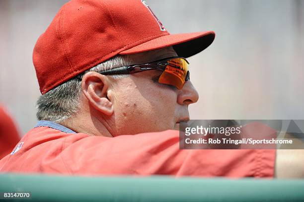 Manager Mike Scioscia of the Los Angeles Angels of Anaheim looks on from the dug out against the Philadelphia Phillies at Citizens Bank Park on June...