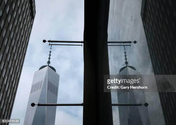 One World Trade Center is refelcted in a window on August 12, 2017 in New York City.