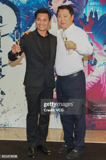 Thailand actor Tony Jaa and Polybona Films CEO Yu Dong arrive at the red carpet of the premiere of film "Paradox" on August 14, 2017 in Beijing,...