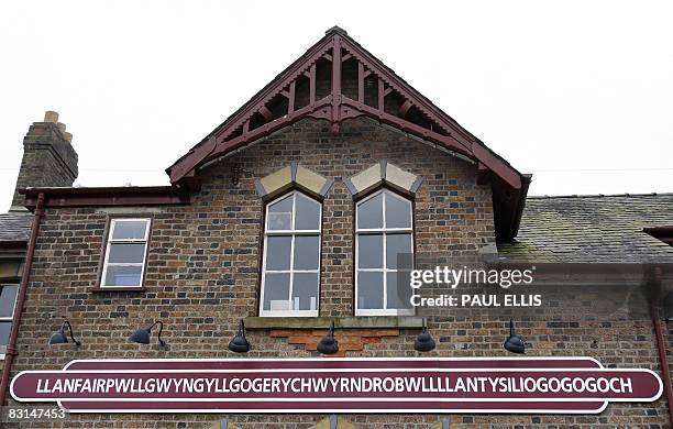 The town sign at the former waiting room of Llanfairpwllgwyngyllgogerychwyrndrobwllllantysiliogogogoch railway station is pictured in Anglesey,...