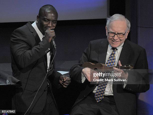 Singer Akon and Warren Buffett at the Peter Buffett performance at The Paley Center for Media on October 3, 2008 in Beverly Hills, California.