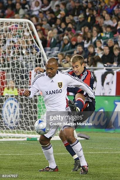 Taylor Twellman the New England Revolution and Robbie Russell of Real Salt Lake battle for the ball during the game on October 4, 2008 at Gillette...