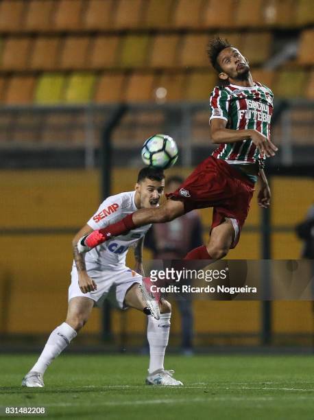 Zeca of Santos battles for the ball with Gustavo Scarpa of Fluminense during the match between Santos and Fluminense as a part of Campeonato...