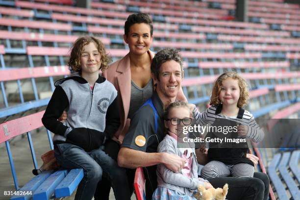 Robert Murphy and his wife Justine Murphy pose with their children Jarvis, Frankie and Delilah following his AFL retirement announcement during a...