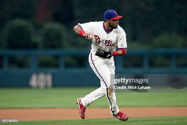 Pedro Feliz of the Philadelphia Phillies fields an infield ball during Game 1 of the NLDS Playoffs against the Milwaukee Brewers at Citizens Bank...