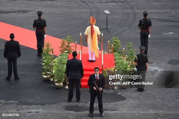 Special Protection Group agents keep watch as Indian Prime Minister Narendra Modi attends a ceremony for the country's Independence Day celebrations,...