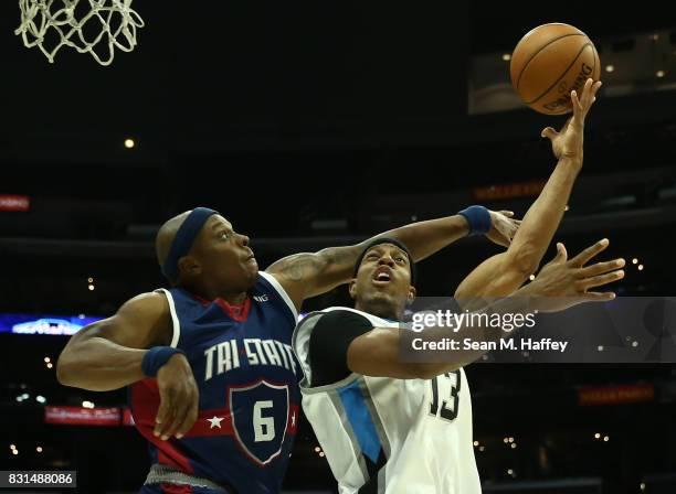 Jerome Williams of the Power throws up a shot against Bonzi Wells of the Tri-State during week eight of the BIG3 three on three basketball league at...