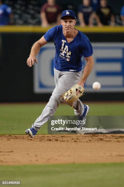 Chase Utley of the Los Angeles Dodgers fields ground balls during batting practice before the MLB game against the Arizona Diamondbacks at Chase...