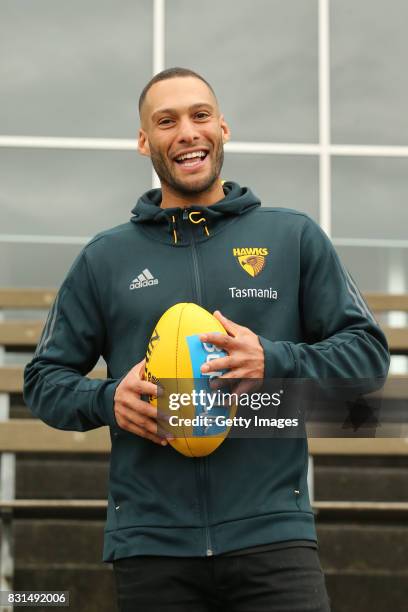 Hawthorn Hawks defender Josh Gibson poses for a photo following his AFL retirement announcement during a press conference at Waverley Park on August...