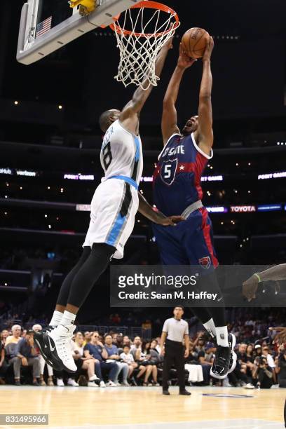 Dominic McGuire of the Tri-State goes up for a dunk against Rasual Butler of the Power during week eight of the BIG3 three on three basketball league...