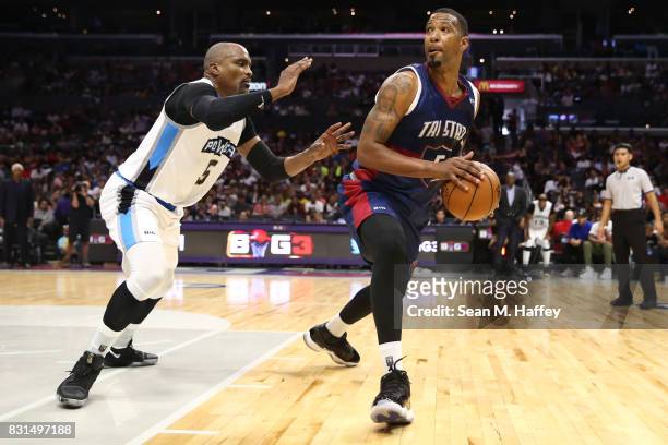 Dominic McGuire of the Tri-State drives with the ball against Cuttino Mobley of the Power during week eight of the BIG3 three on three basketball...