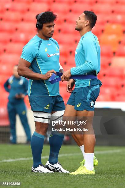 Lopeti Timani and Israel Folau stretch during an Australian Wallabies training session at Pepper Stadium on August 15, 2017 in Sydney, Australia.