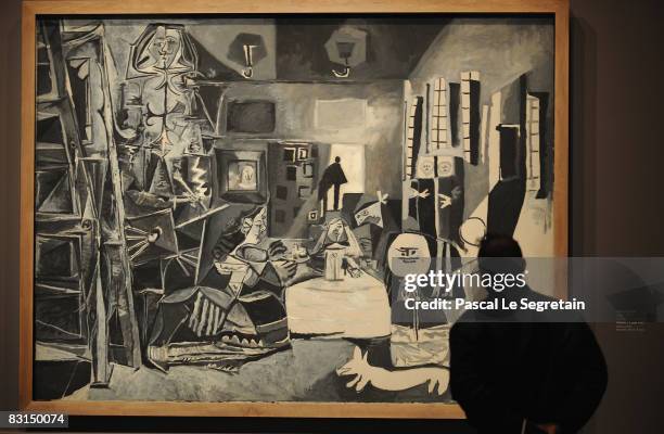 Member of the press looks at Picasso's painting "Les Melines d'apres Velasquez" on October 6, 2008 in Paris, France. The exhibition of "Picasso et...