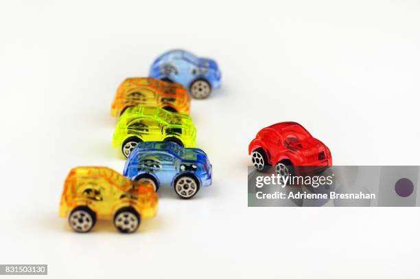 breaking away from the pack - toy car white background stock pictures, royalty-free photos & images