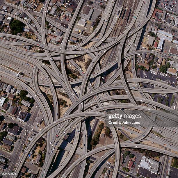 exaggerated complex freeway interchanges - high angle view stockfoto's en -beelden