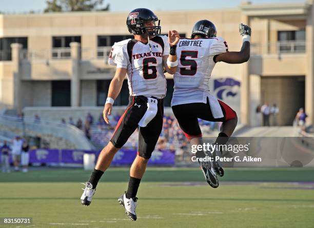 Quarterback Graham Harrell of the Texas Tech Red Raiders celebrates after scoring a fourth quarter touchdown with teammate Michael Crabtree, during a...