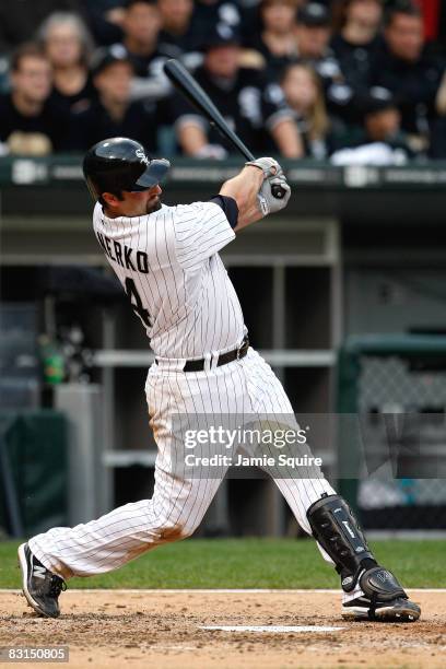 Paul Konerko of the Chicago White Sox hits a solo home run in the bottom of the fourth inning against the Tampa Bay Rays in Game Four of the ALDS...