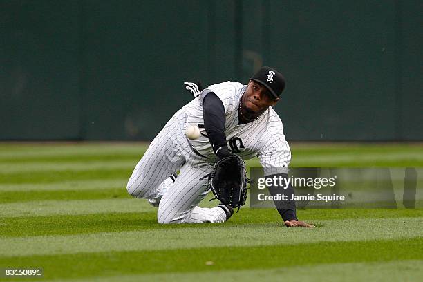 Ken Griffey Jr. #17 of the Chicago White Sox makes a diving catch for the third out in the top of the fourth inning on a ball hit by Josh Bartlett of...