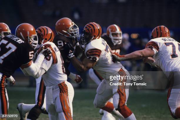Tackle Anthony Munoz of the Cincinnati Bengals blocks a defender for the Cleveland Browns during a game on December 2, 1984 at Municipal Stadium in...