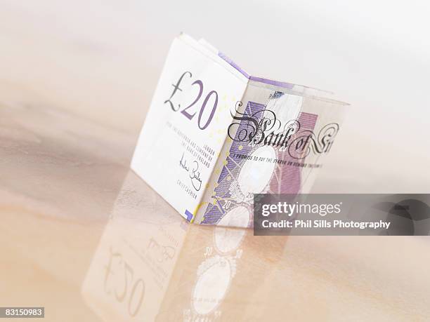 folded 20 pound sterling note - twenty pound note stock pictures, royalty-free photos & images