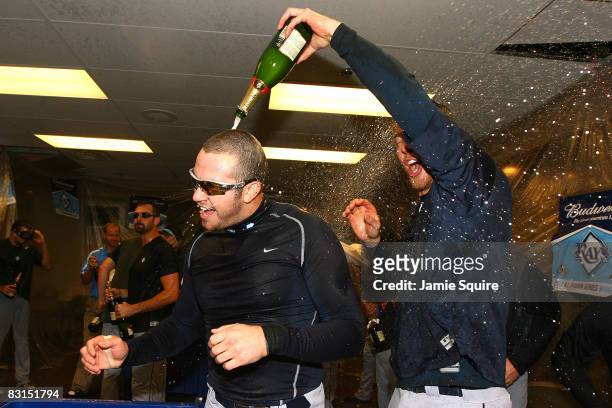 Evan Longoria of the Tampa Bay Rays celebrates with teammates in the locker room after their 6-2 win against the Chicago White Sox in Game Four of...