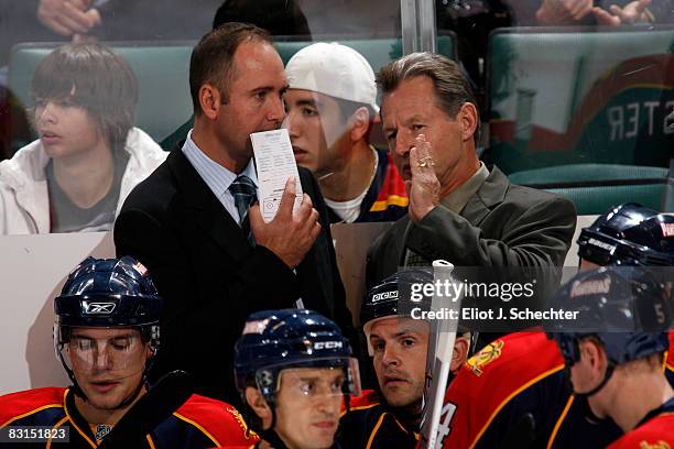 Head coach Peter DeBoer and assistant coach Mike Kitchen of the Florida Panthers talk during preseason action against the New York Islanders at the...