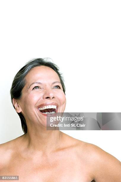 mature woman with bare shoulders laughing - beautiful bare women fotografías e imágenes de stock