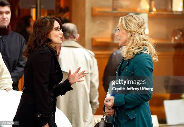 Actresses Tina Fey and Jane Krakowski stand on location during filming for "30 Rock" at Rockefeller Center on October 6, 2008 in New York City.