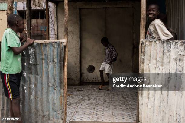 Boy plays soccer in the Mathare North neighborhood on August 14, 2017 in Nairobi, Kenya. Nairobi remained peaceful, but tensions remain high as...