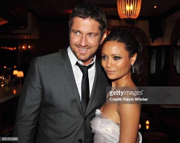Actors Gerard Butler and Thandie Newton pose at the afterparty for the premiere of Warner Brothers Picture's "Rocknrolla" at the Crown Bar on October...