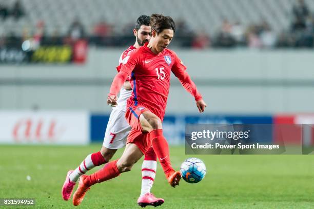 Hong Jeongho of Korea Republic battles for the ball with Omar Kharbin of Syria during their 2018 FIFA World Cup Russia Final Qualification Round...
