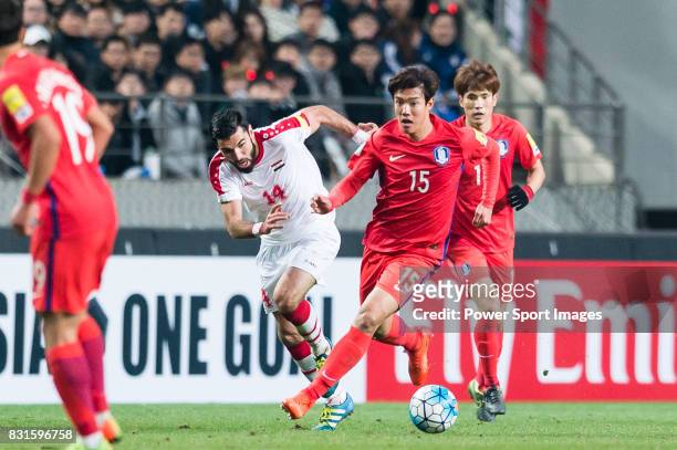 Hong Jeongho of Korea Republic fights for the ball with Tamer Mohamd of Syria during their 2018 FIFA World Cup Russia Final Qualification Round Group...