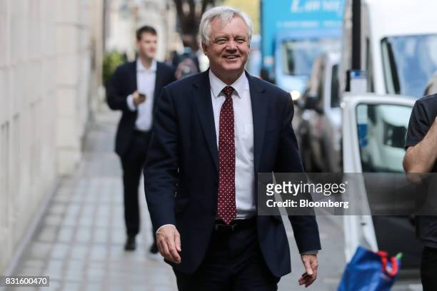 David Davis, U.K. Exiting the European Union secretary, walks in-between doing media interviews in London, U.K., on Tuesday, Aug. 15, 2017. The U.K....