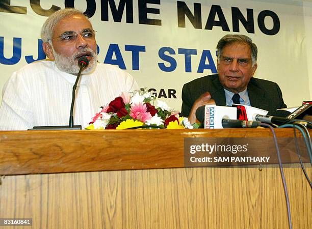 Chairman of Indian auto makers Tata Motors, Ratan Tata looks on as chief minister of the Indian state of Gujarat Narendra Modi addresses media...