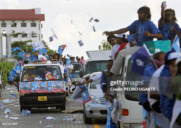 Supporters of Maldives president and Dhivehi Rahyithunge Party's presidential candidate Maumoon Abdul Gayoom take part in an electoral caravan in...